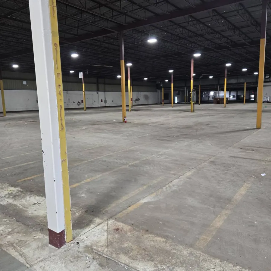 Empty warehouse floor with new trench drain installation in Oakville